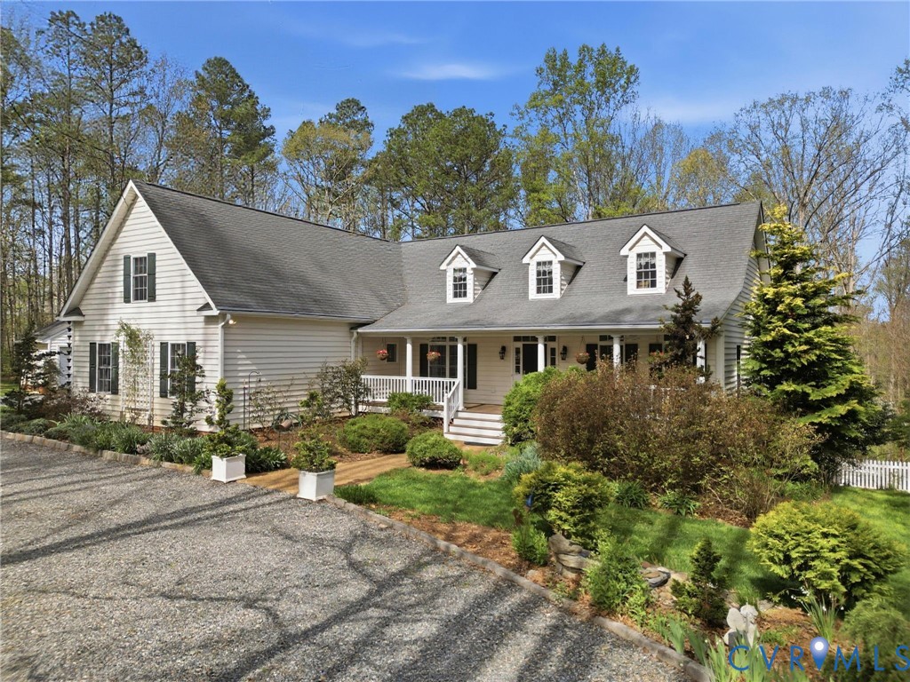 14430 Overlook Ridge Lane Beaverdam, VA 23015 - Photo 7 of 71 a front view of a house with a garden