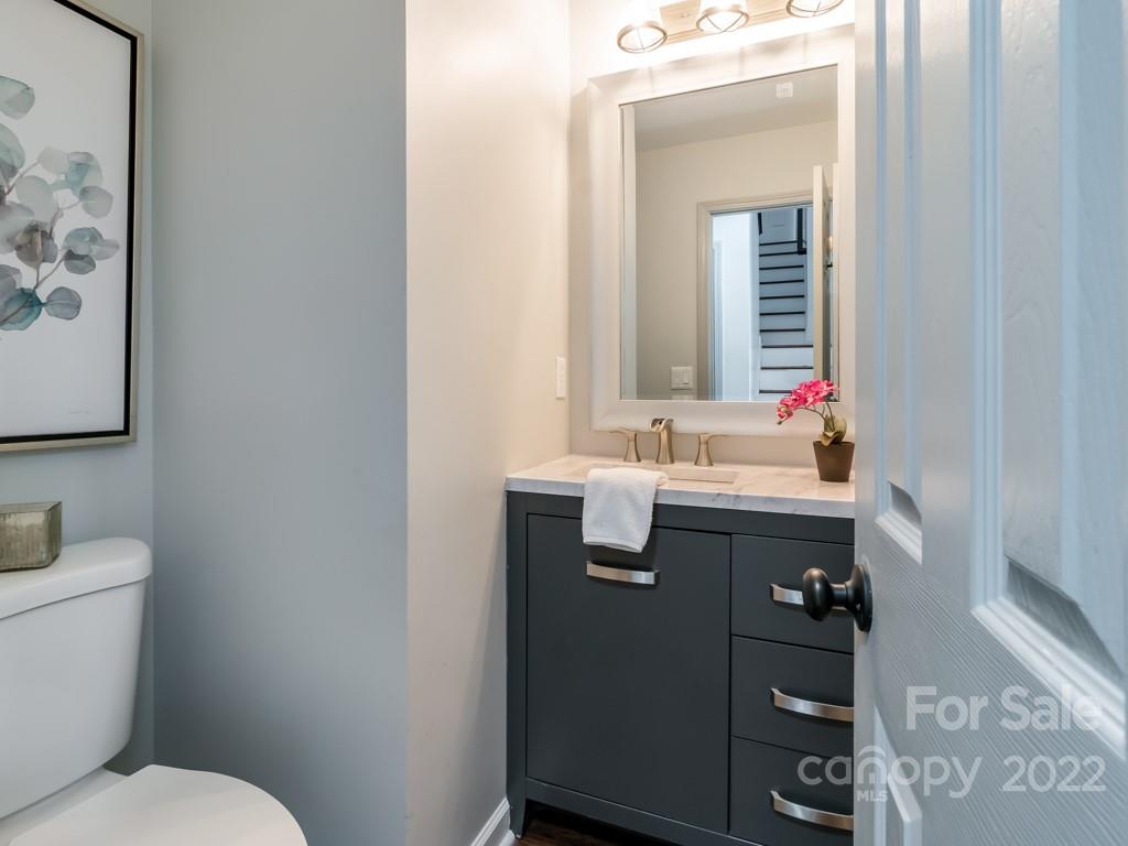 5510 Rogers Road Indian Trail, NC 28079 - Photo 17 of 35 a bathroom with a sink mirror and toilet