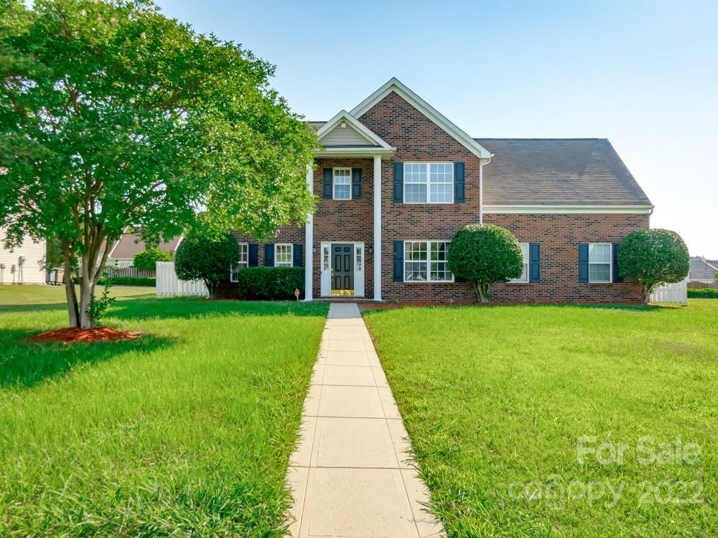 5510 Rogers Road Indian Trail, NC 28079 - Photo 2 of 35 a front view of a house with a yard