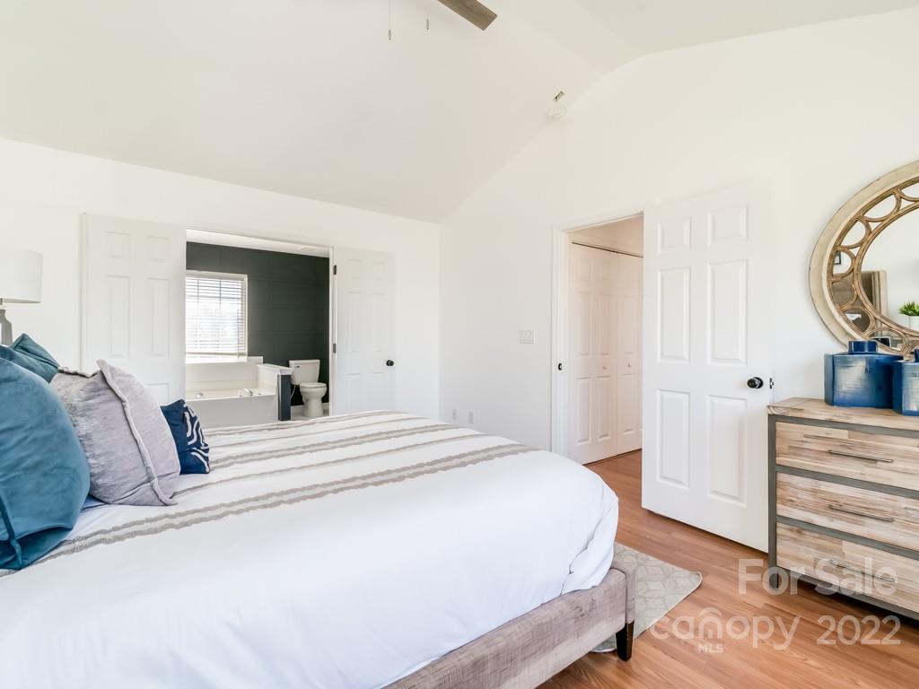 5510 Rogers Road Indian Trail, NC 28079 - Photo 22 of 35 a bedroom with a bed and a mirror