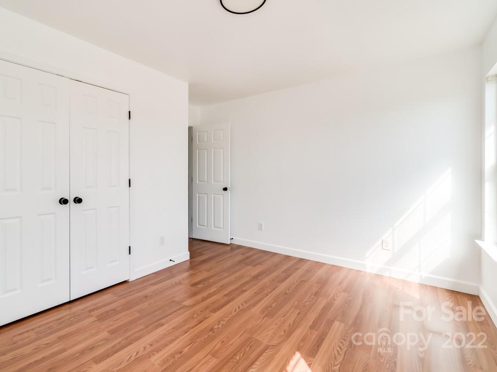 5510 Rogers Road Indian Trail, NC 28079 - Photo 29 of 35 a view of an empty room with wooden floor