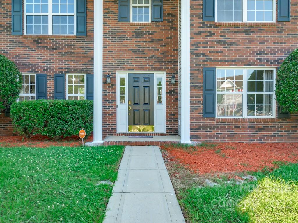 5510 Rogers Road Indian Trail, NC 28079 - Photo 3 of 35 front view of a brick house with a yard