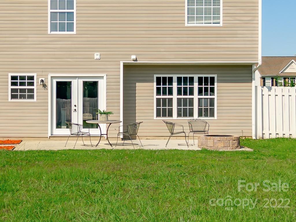 5510 Rogers Road Indian Trail, NC 28079 - Photo 32 of 35 a house view with a sitting space and garden