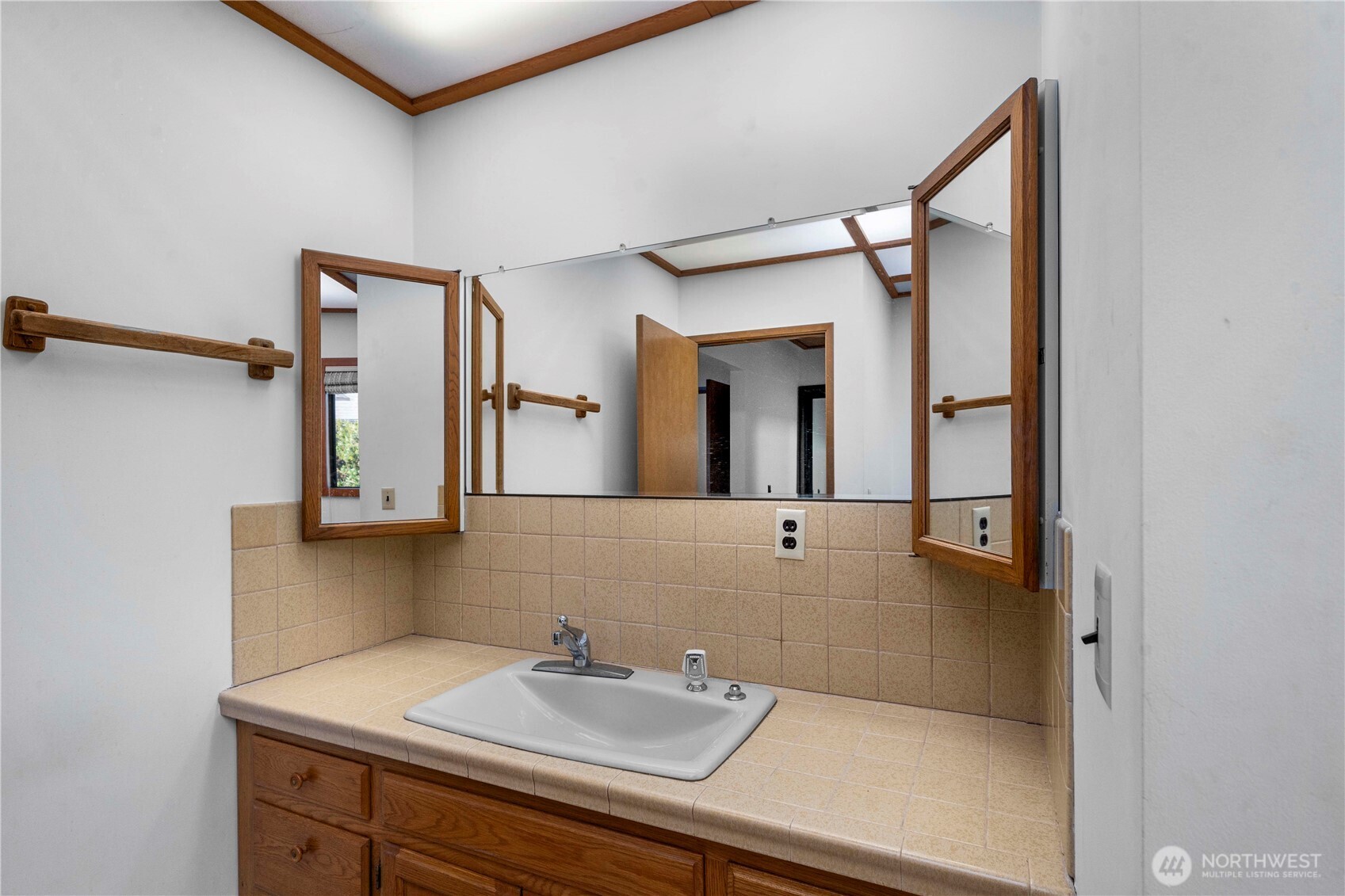 491 Bachelor Road Sequim, WA 98382 - Photo 15 of 39 a bathroom with a sink and a mirror