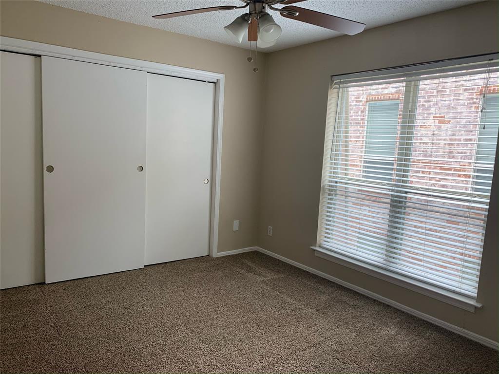 3121 Rosedale Avenue University Park, TX 75205 - Photo 13 of 16 Bedroom featuring a ceiling fan with integrated lighting, a spacious window with horizontal blinds, and carpet.