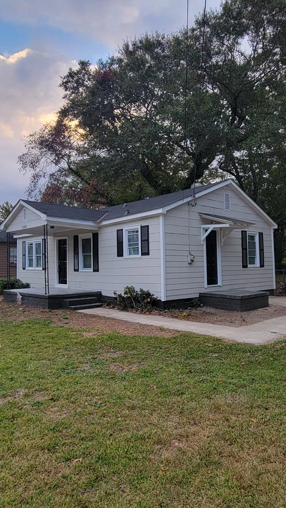 2502 Heard Street Columbus, GA 31906 - Photo 1 of 4 a front view of a house with a garden