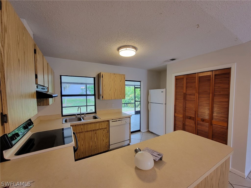 7510-7512 Love Road Fort Myers, FL 33967 - Photo 4 of 16 a bed room with a bed and a television