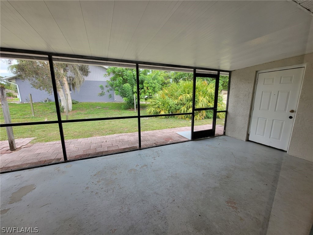 7510-7512 Love Road Fort Myers, FL 33967 - Photo 9 of 16 a view of empty room with sliding glass door