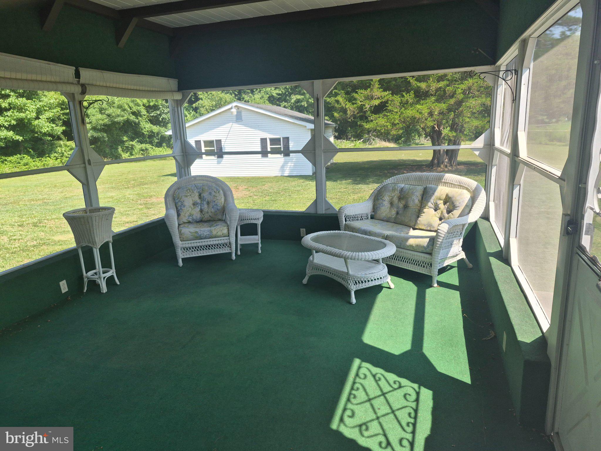 1043 Camp Road Denton, MD 21629 - Photo 8 of 17 Serene sunlit porch retreat.