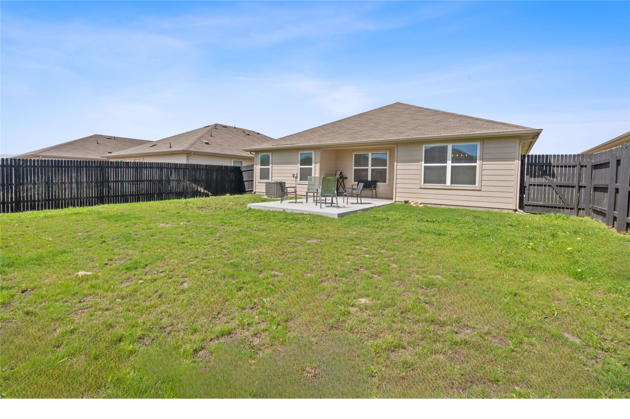 5805 Brampton Lane Austin, TX 78724 - Photo 15 of 17 Rear view of property with a patio and a fenced backyard