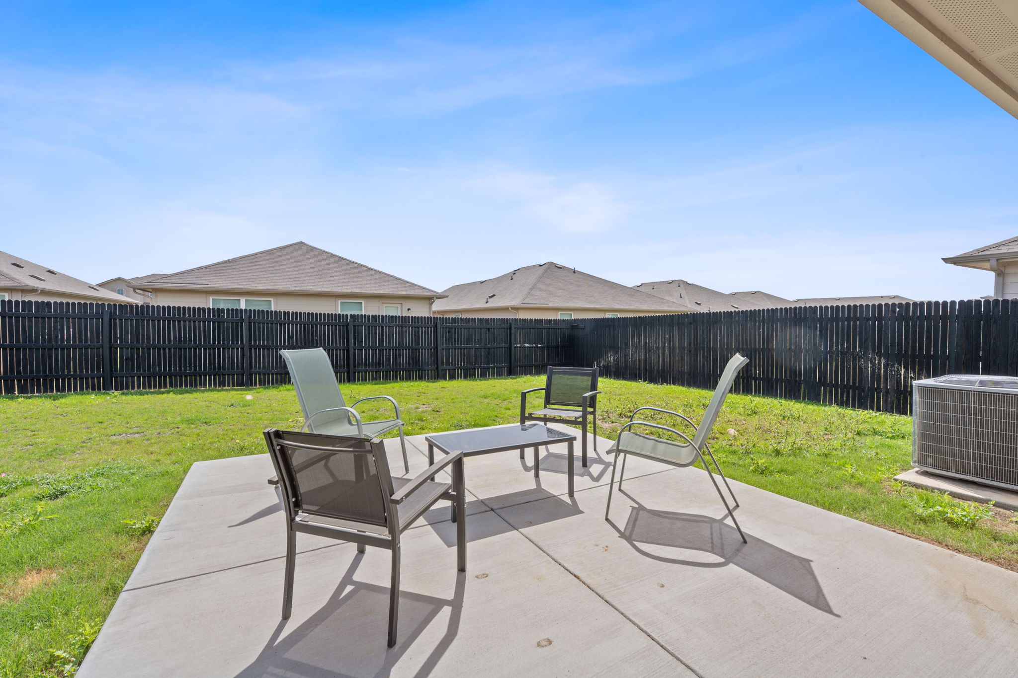 5805 Brampton Lane Austin, TX 78724 - Photo 16 of 17 Fenced backyard with a patio area