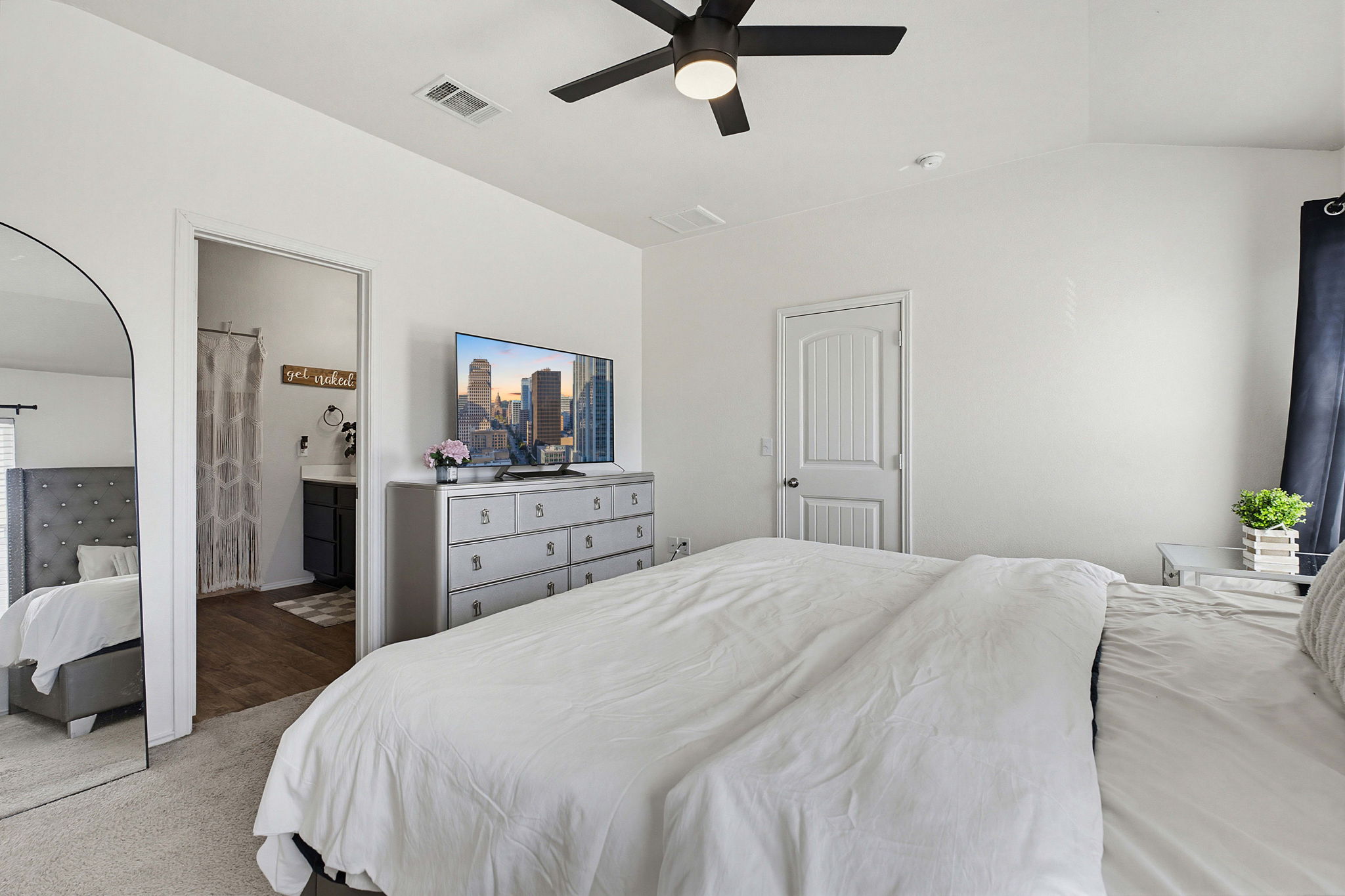 5805 Brampton Lane Austin, TX 78724 - Photo 8 of 17 Carpeted bedroom with a ceiling fan and ensuite bathroom