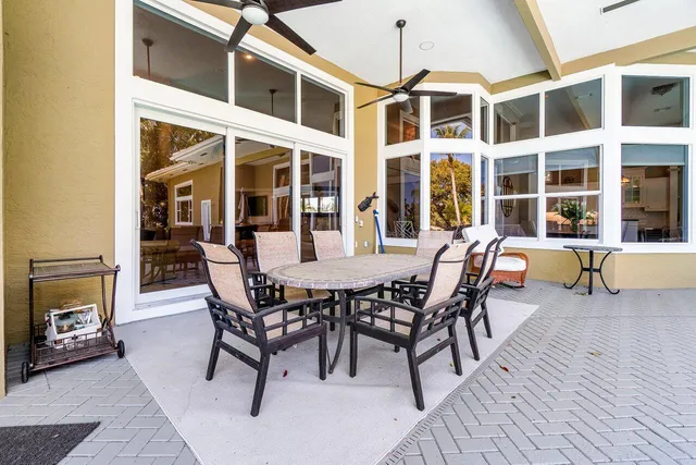 a view of a dining room with furniture and a fireplace