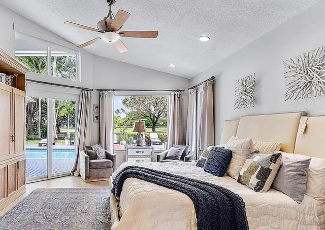 a bed room with a bed and a large window