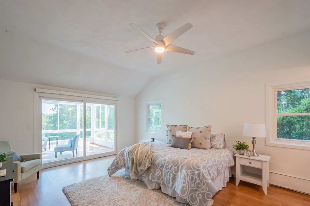 188 Spring Street Lexington, MA 02421 - Photo 18 of 42 a spacious bedroom with a bed and a large window