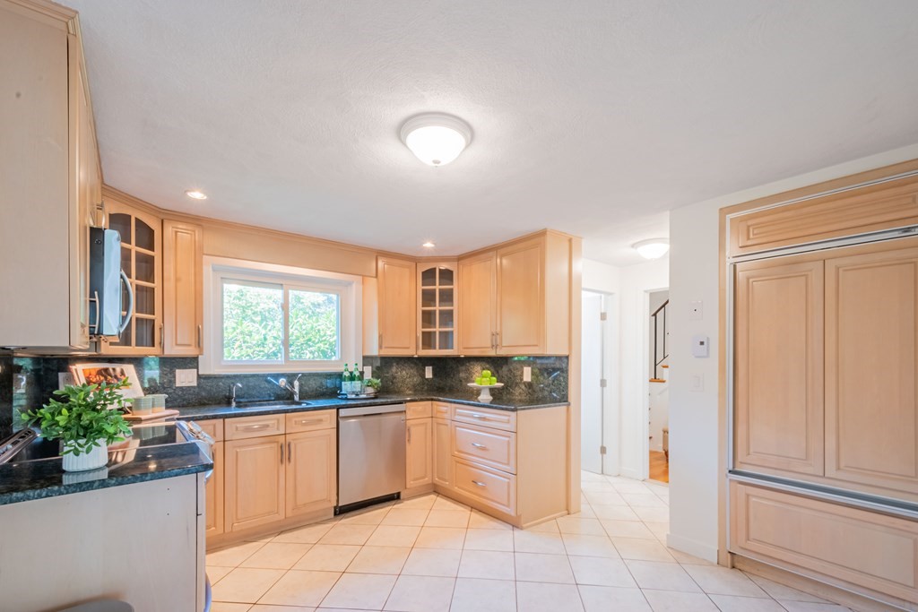 188 Spring Street Lexington, MA 02421 - Photo 8 of 42 a kitchen with granite countertop a refrigerator and window