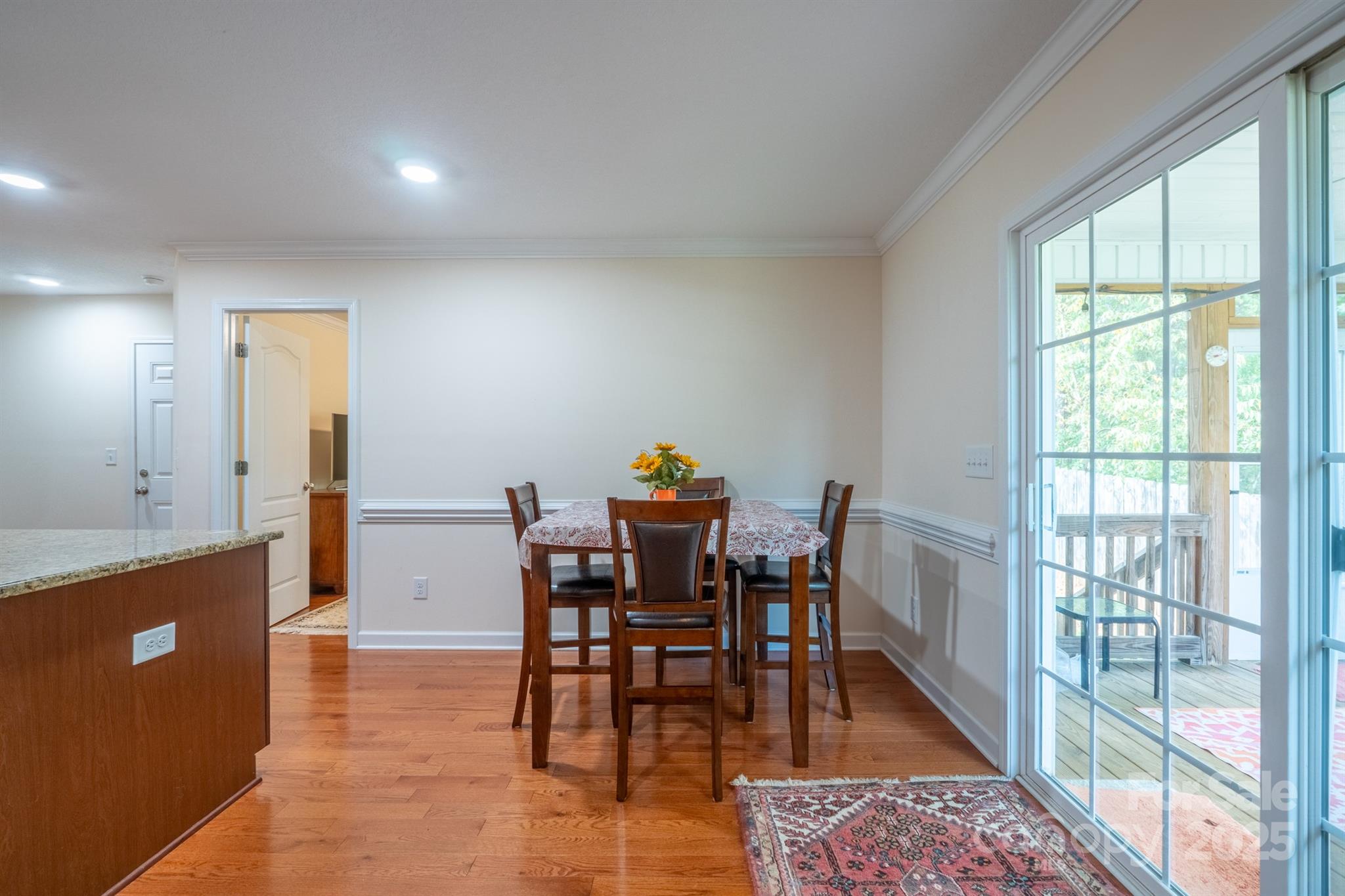 1812 Sam Smith Road Fort Mill, SC 29708 - Photo 20 of 43 a view of a dining room with furniture window and wooden floor
