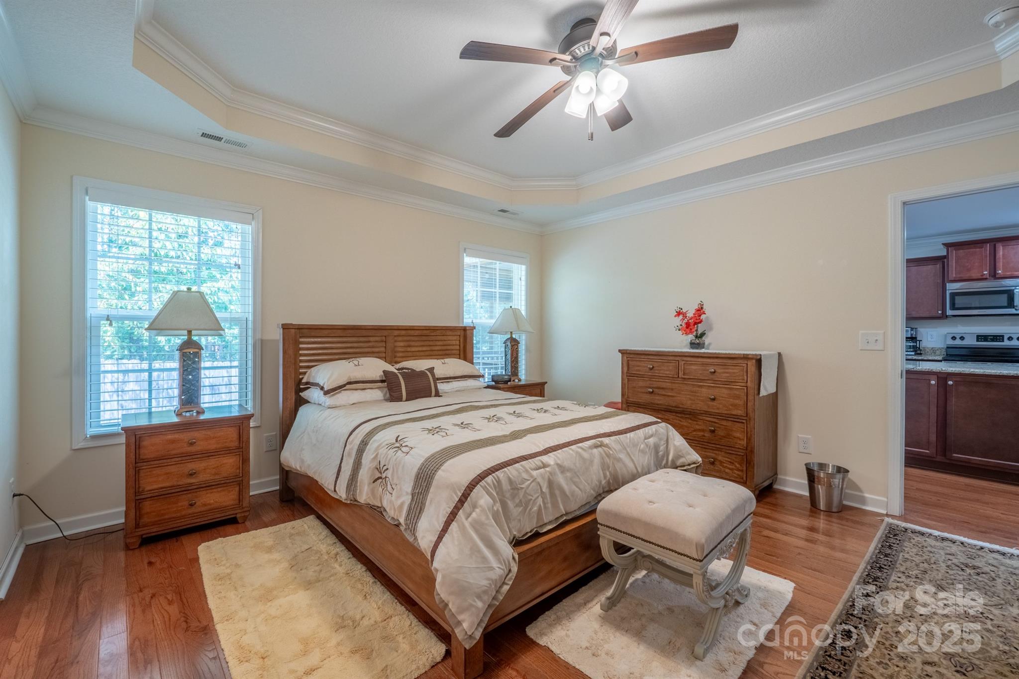 1812 Sam Smith Road Fort Mill, SC 29708 - Photo 21 of 43 a bedroom with a bed and wooden floor