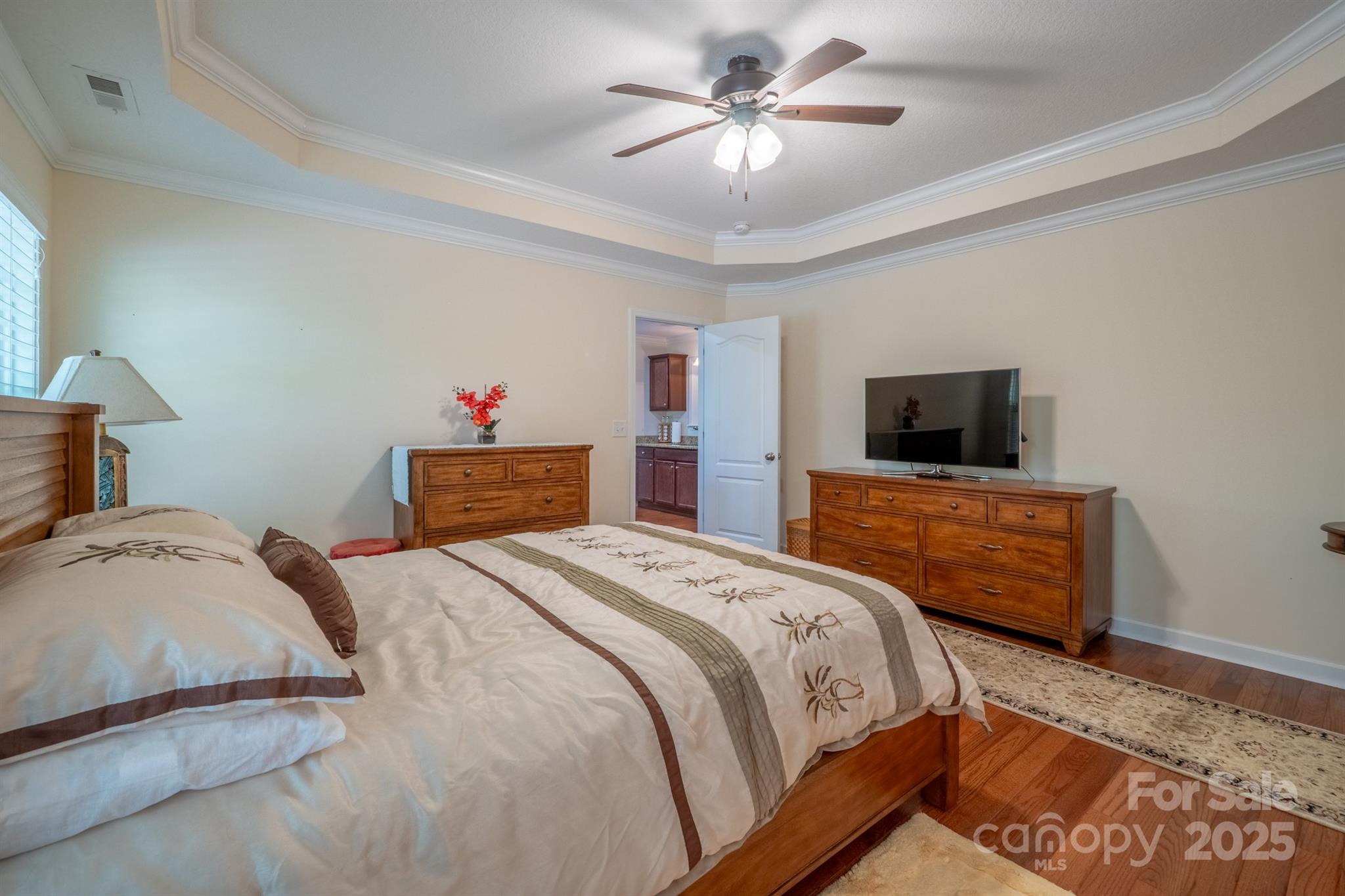 1812 Sam Smith Road Fort Mill, SC 29708 - Photo 22 of 43 a bedroom with a bed and a flat screen tv