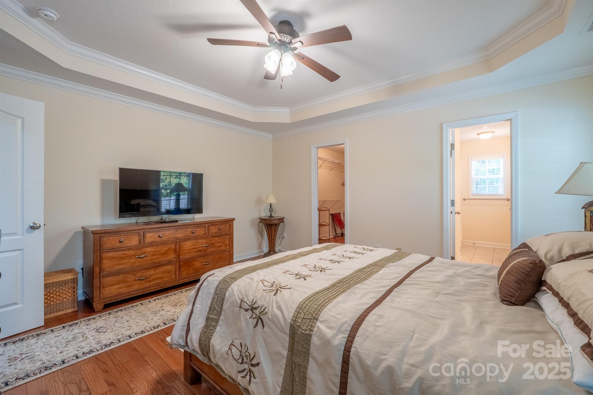 1812 Sam Smith Road Fort Mill, SC 29708 - Photo 23 of 43 a bedroom with a bed and a dresser