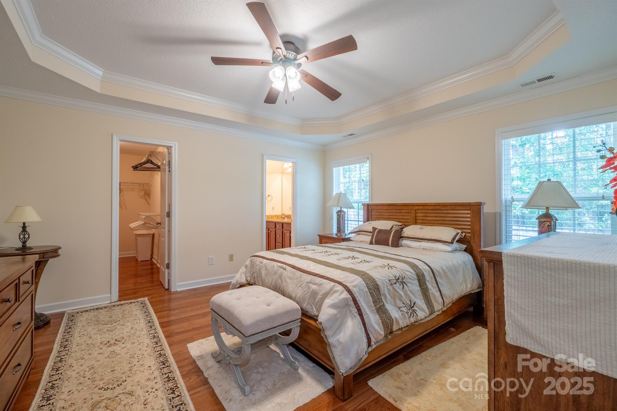 1812 Sam Smith Road Fort Mill, SC 29708 - Photo 24 of 43 a bedroom with a bed and wooden floor