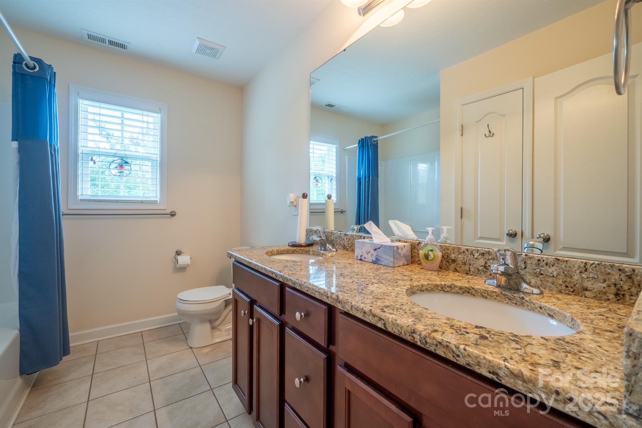 1812 Sam Smith Road Fort Mill, SC 29708 - Photo 25 of 43 a bathroom with a granite countertop sink and a mirror