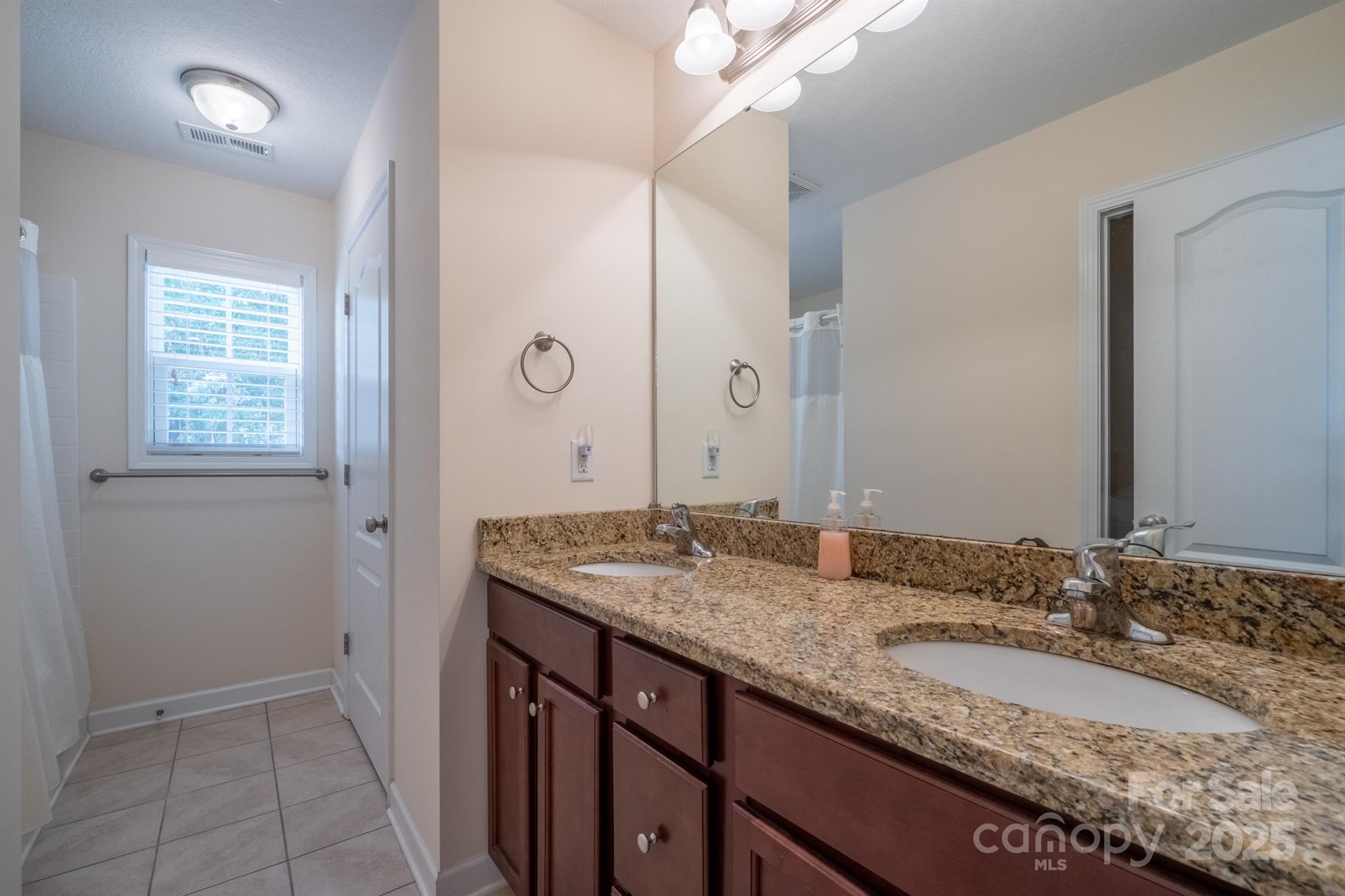 1812 Sam Smith Road Fort Mill, SC 29708 - Photo 26 of 43 a bathroom with a granite countertop sink and a mirror