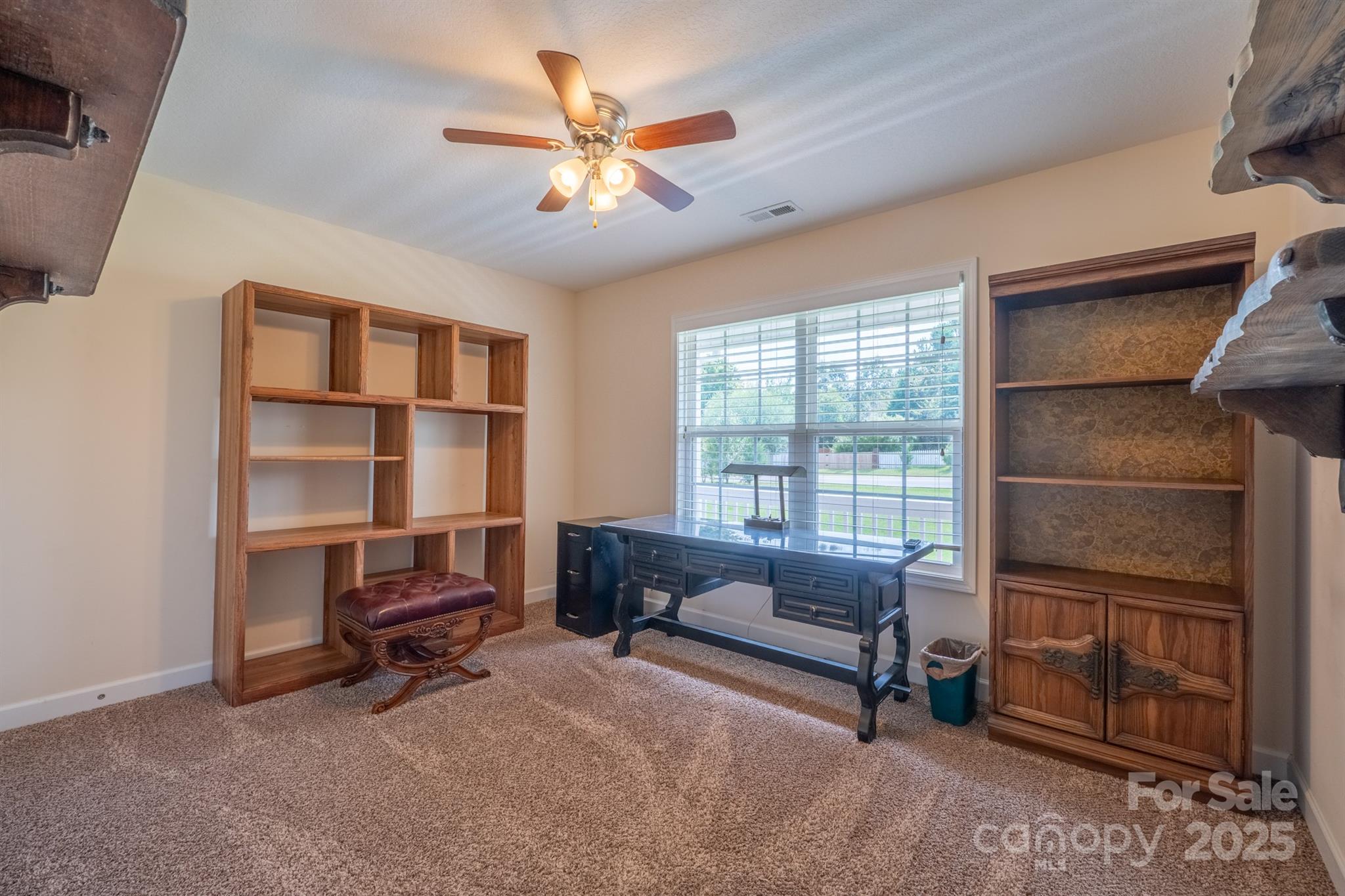1812 Sam Smith Road Fort Mill, SC 29708 - Photo 31 of 43 a living room with furniture a ceiling fan and a window