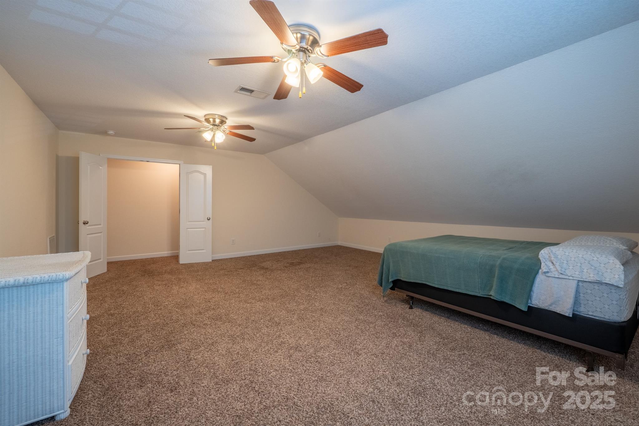 1812 Sam Smith Road Fort Mill, SC 29708 - Photo 34 of 43 a bedroom with a bed and a chandelier