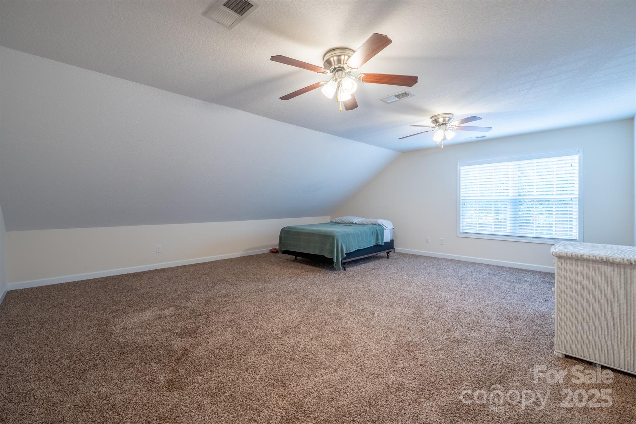 1812 Sam Smith Road Fort Mill, SC 29708 - Photo 36 of 43 an empty room with windows and ceiling fan view