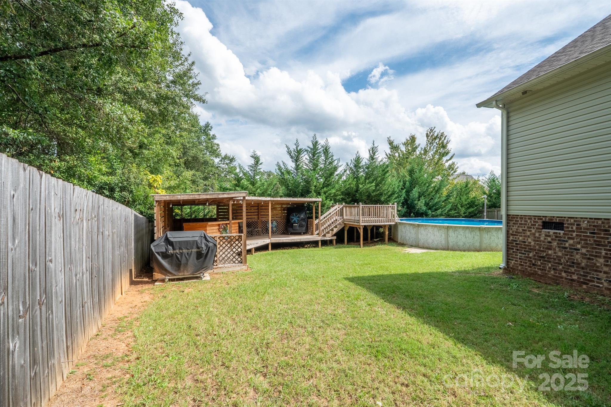1812 Sam Smith Road Fort Mill, SC 29708 - Photo 39 of 43 a view of a chair and table in backyard of the house