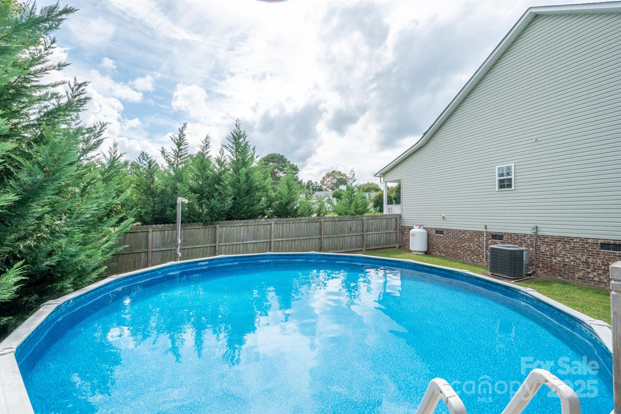 1812 Sam Smith Road Fort Mill, SC 29708 - Photo 6 of 43 a view of a swimming pool with a yard