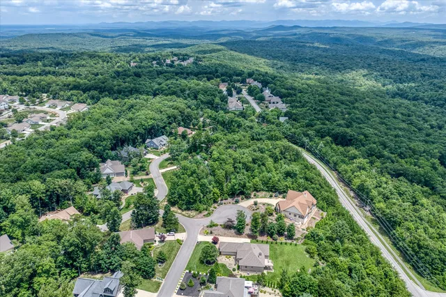 a work room with furniture and large window