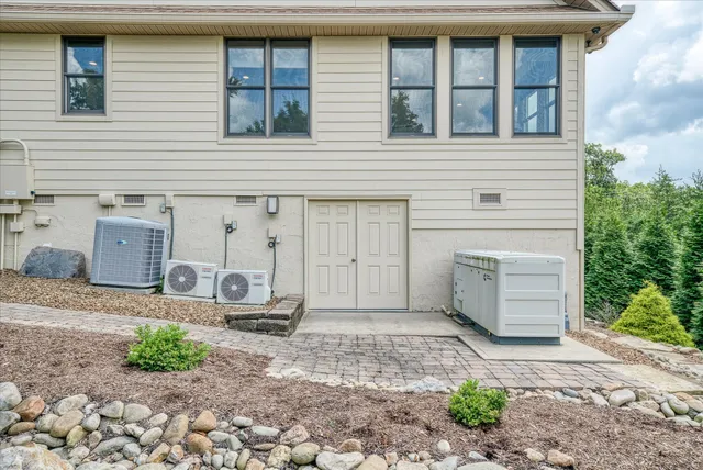 a living room with furniture a window and a fireplace