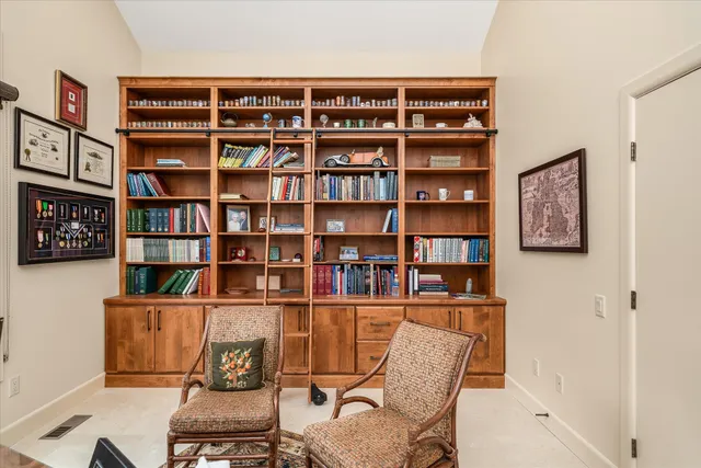 a kitchen with stainless steel appliances kitchen island granite countertop a sink and cabinets