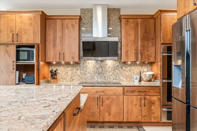 a view of a bedroom with a bed and a window
