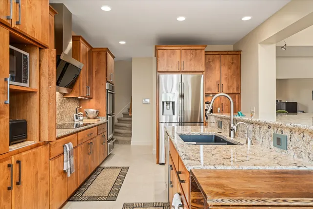 a spacious bedroom with a large bed and a couch