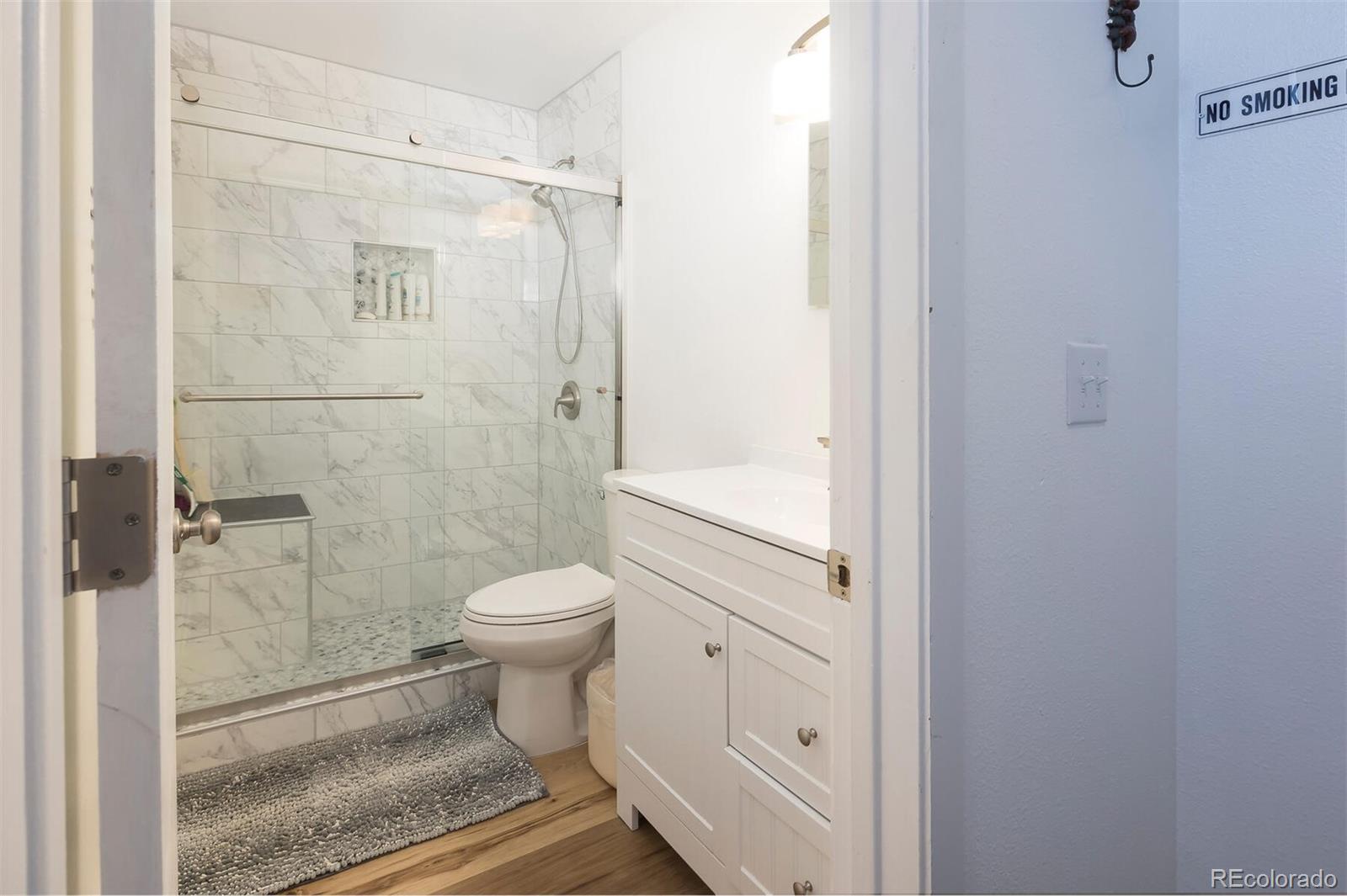 10000 Ryan Gulch Road, Unit 105 Silverthorne, CO 80498 - Photo 15 of 40 a bathroom with a toilet and a shower