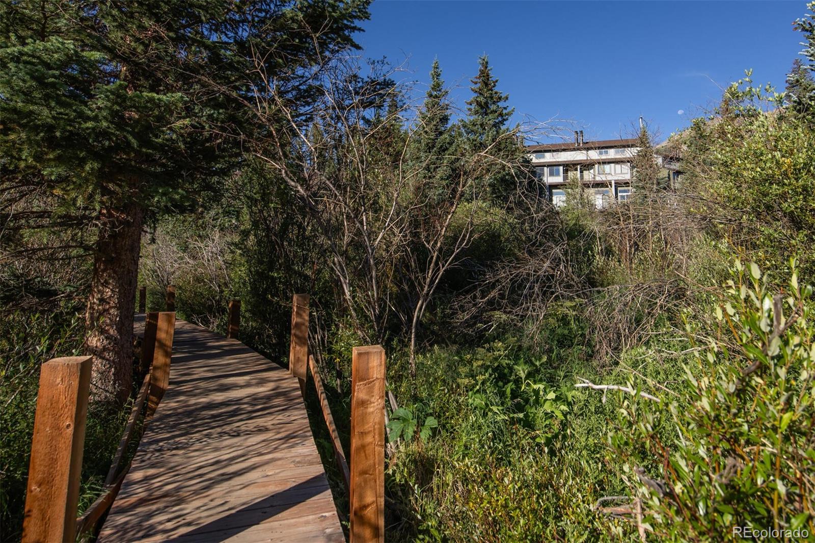 10000 Ryan Gulch Road, Unit 105 Silverthorne, CO 80498 - Photo 21 of 40 a view of a pathway of a building