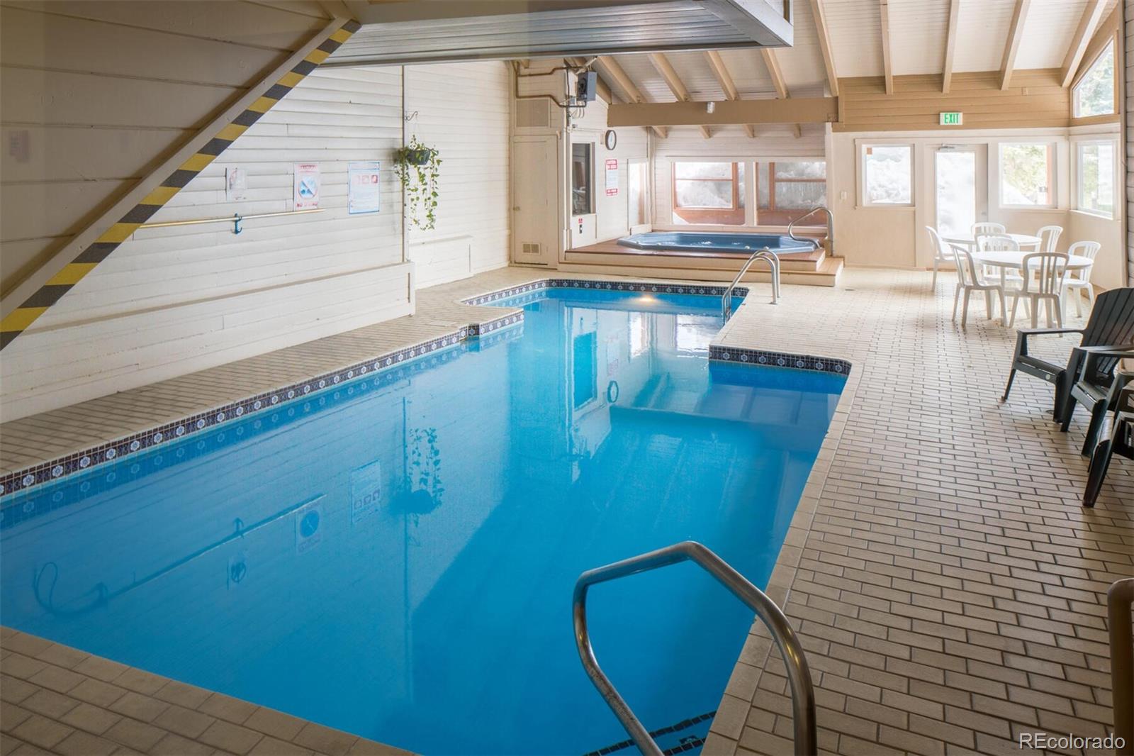 10000 Ryan Gulch Road, Unit 105 Silverthorne, CO 80498 - Photo 32 of 40 a living room with furniture