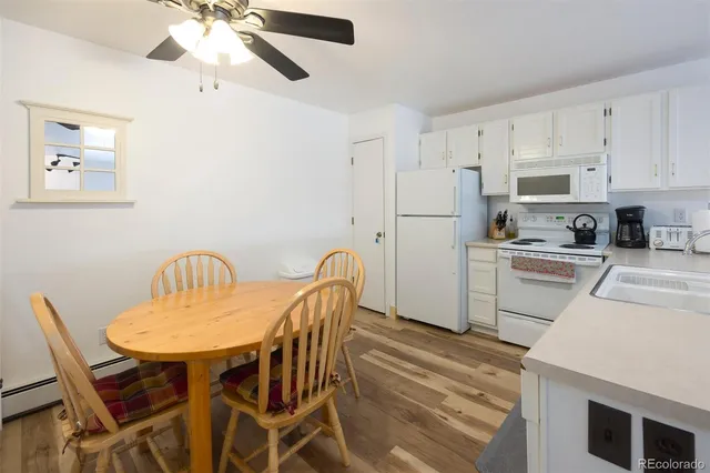 a kitchen with stainless steel appliances a refrigerator sink and cabinets