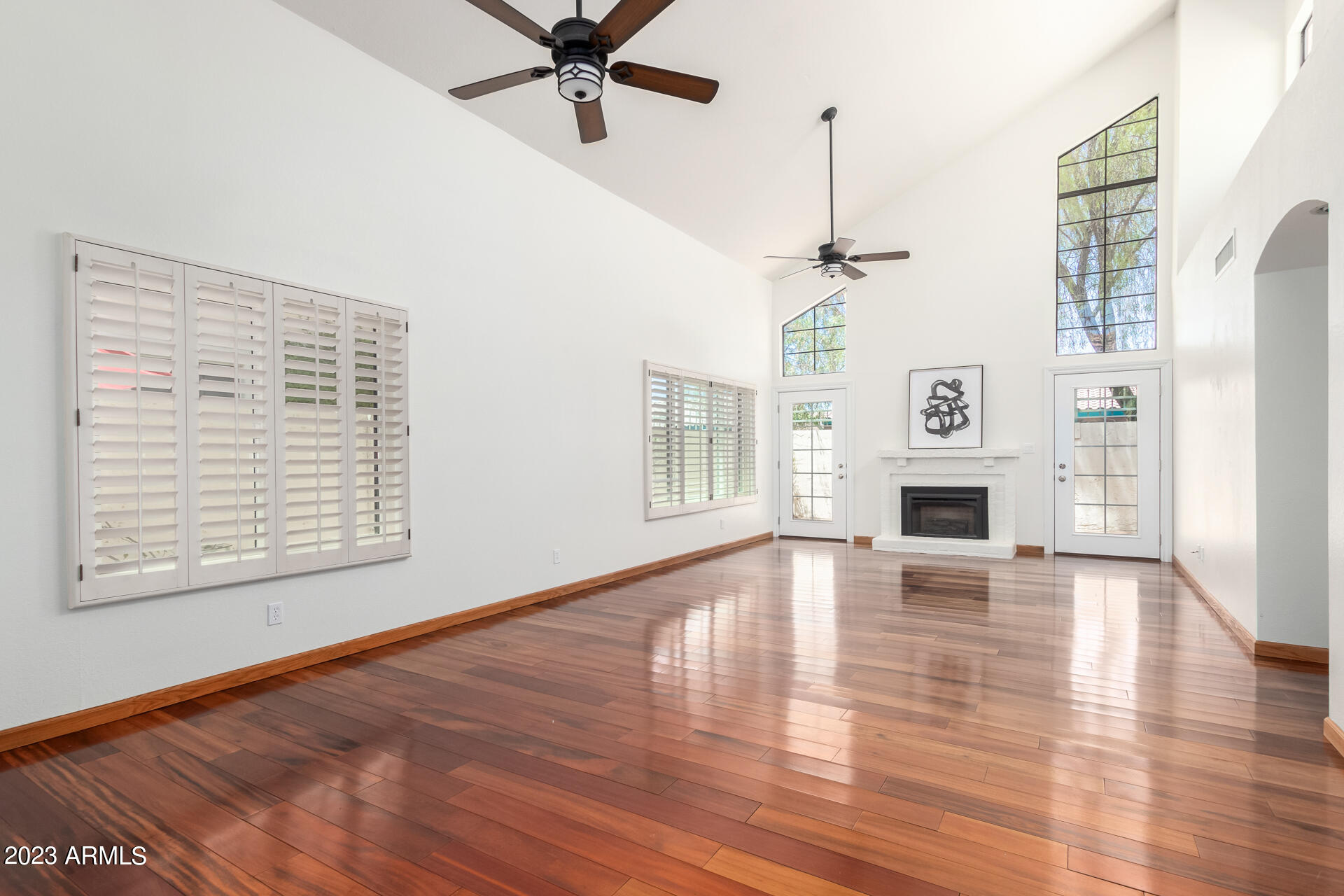 1832 East Ranch Road Tempe, AZ 85284 - Photo 3 of 34 a view of an empty room with window and wooden floor
