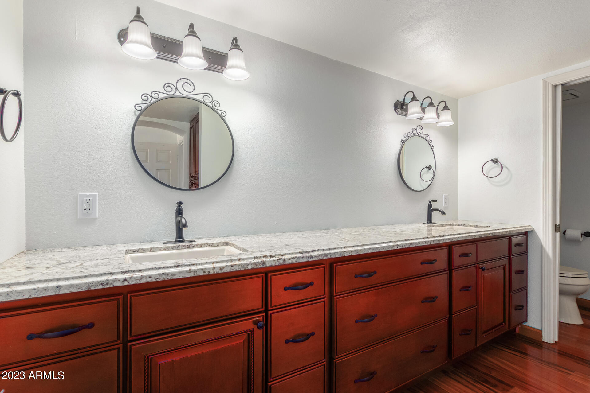 1832 East Ranch Road Tempe, AZ 85284 - Photo 8 of 34 a bathroom with a granite countertop double vanity sink and a mirror