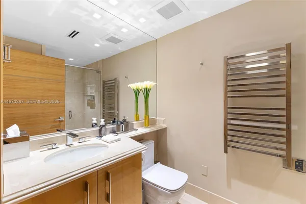 a view of a kitchen with a table and chairs