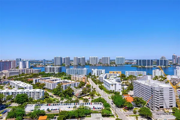 a view of a hallway with wooden floor and stairs
