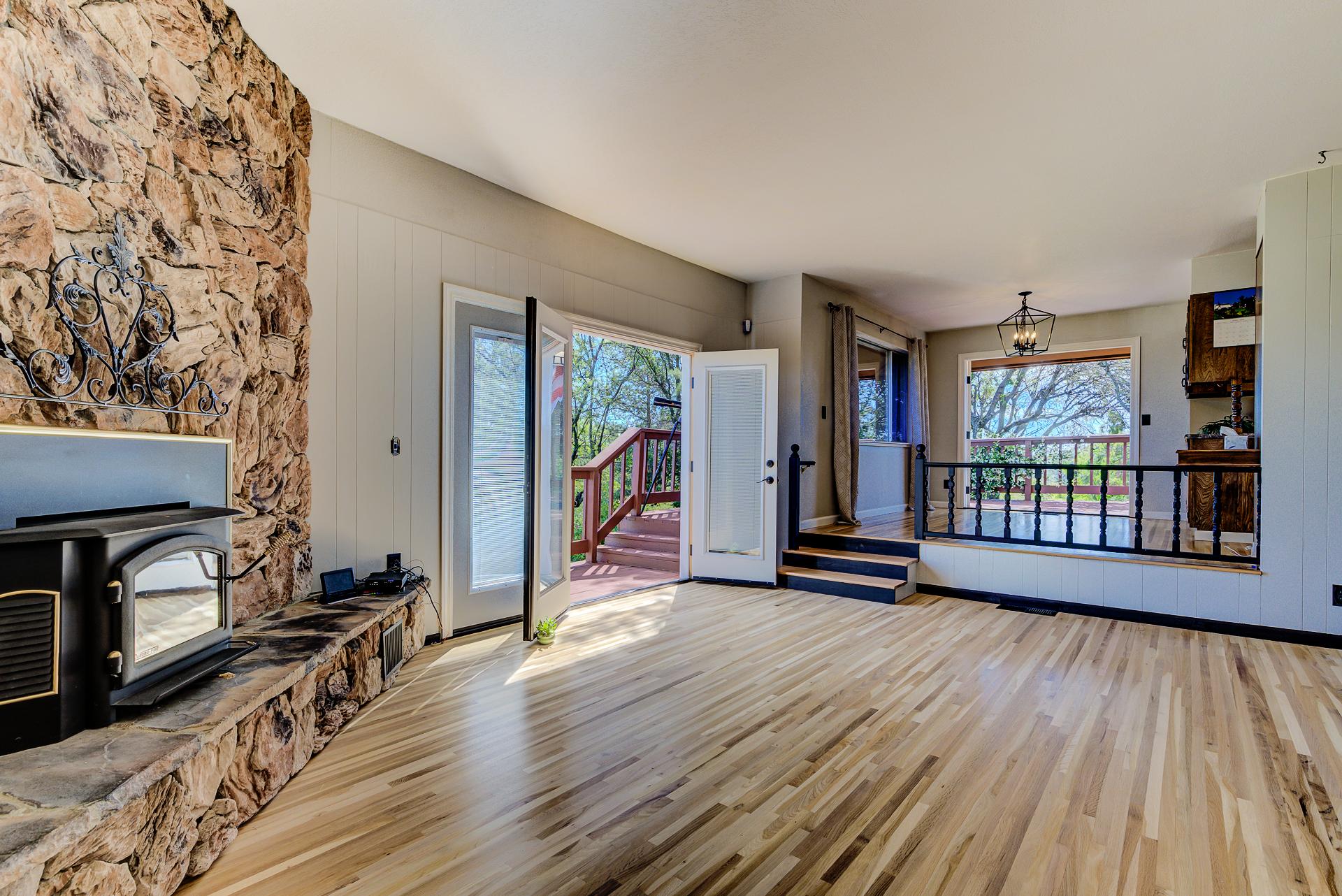 8809 Valley View Road Redding, CA 96001 - Photo 3 of 31 a view of a livingroom with wooden floor and furniture