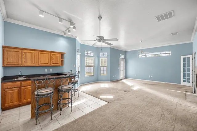a view of a room with furniture and windows