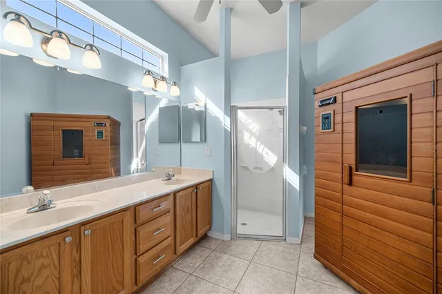 a bathroom with a double vanity sink and a mirror