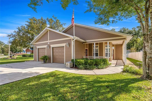 a view of a yard in front view of a house