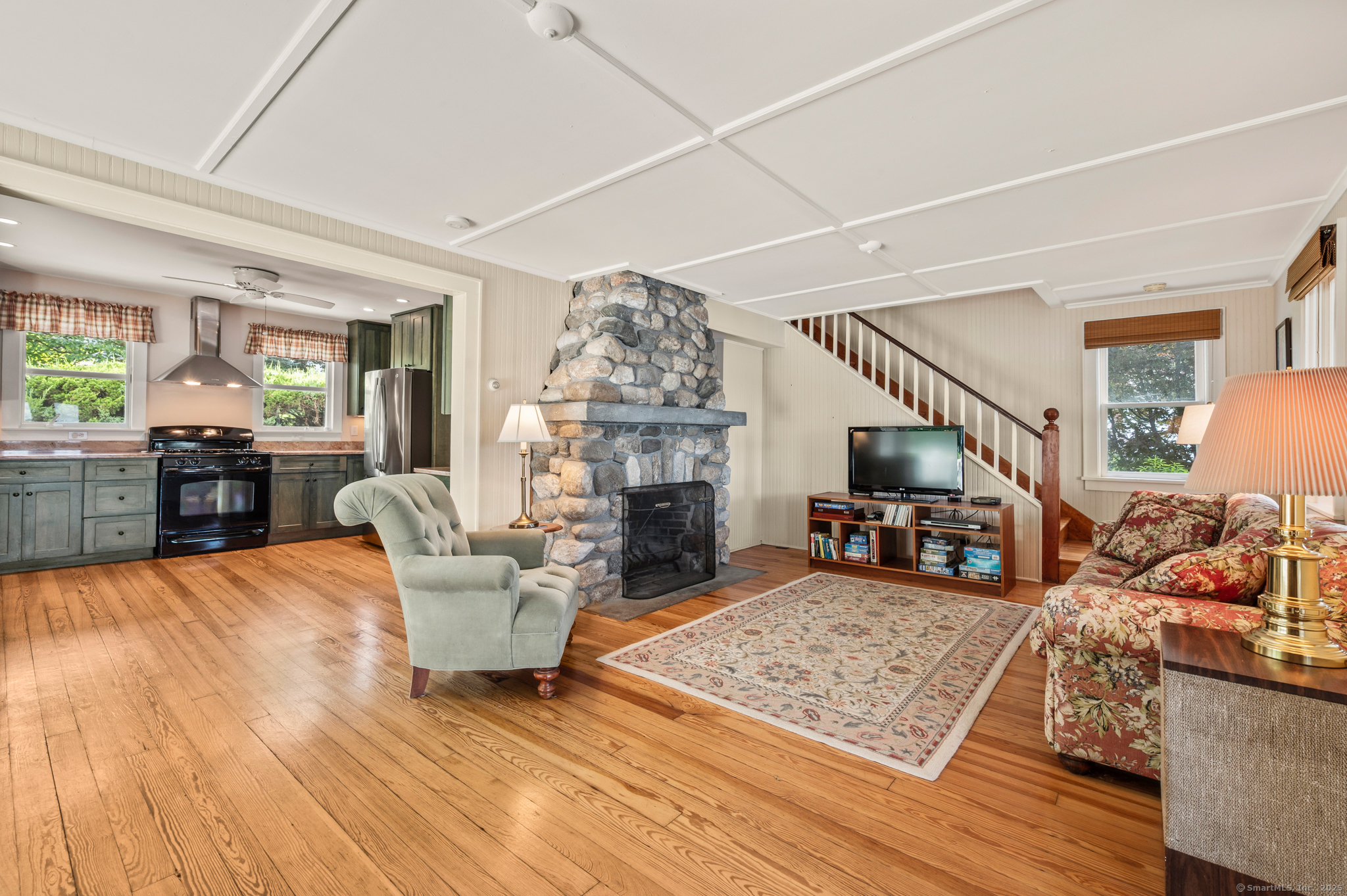 424 Bantam Lake Road Morris, CT 06763 - Photo 12 of 34 a living room with furniture and a fireplace